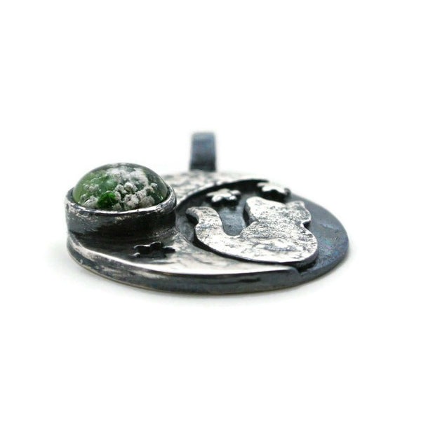 cat moon cremation ashes in glass necklace with green glass front angled view