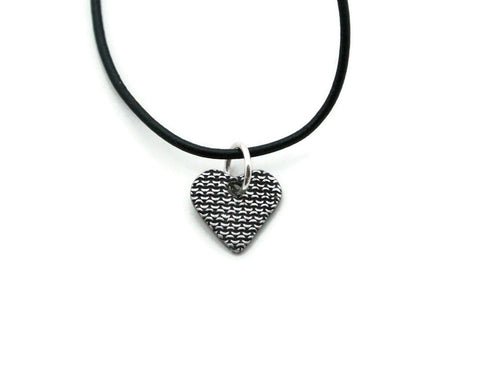Small silver heart pendant with chain mail texture on the black leather cord necklace option