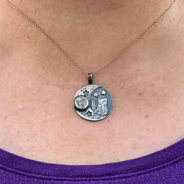 cat moon cremation ashes in glass pet loss necklace on model